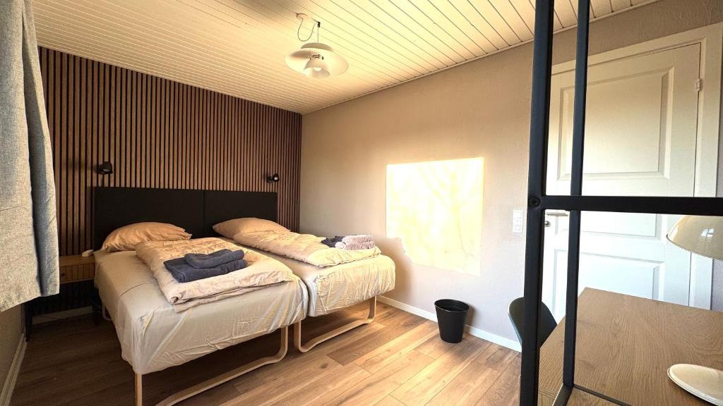 Ein Bett oder Betten in einem Zimmer der Unterkunft Guest Home Oksbøl
