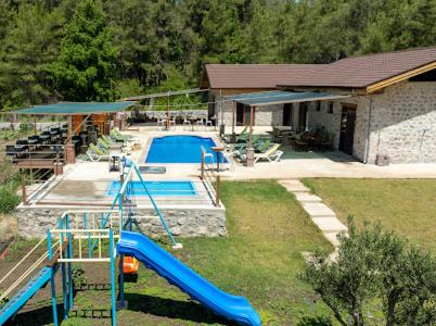 an aerial view of a swimming pool with a playground at Sora no mori in Marmaris
