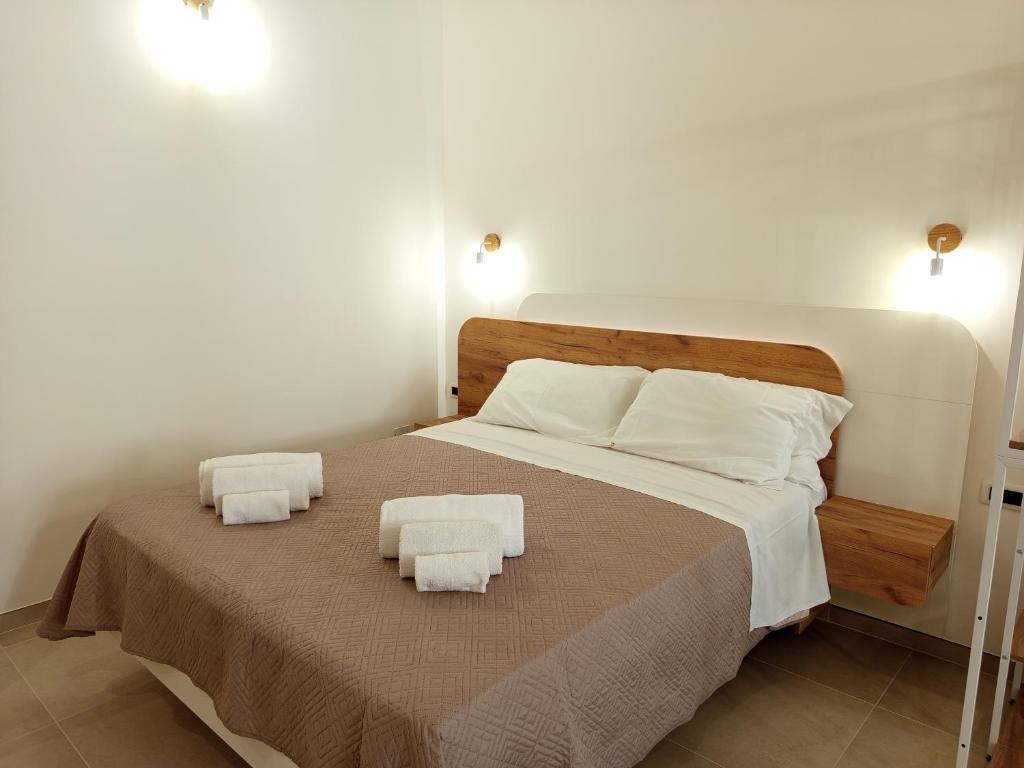 Łóżko lub łóżka w pokoju w obiekcie Casa A&F