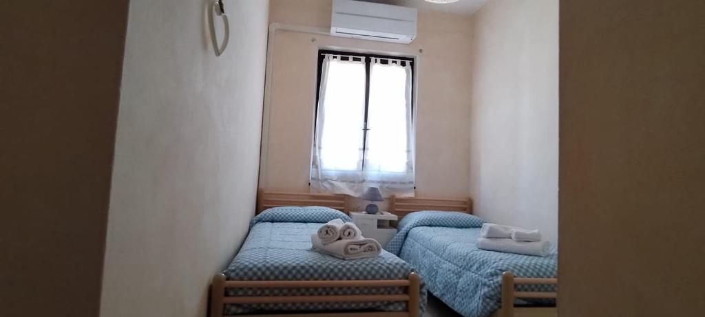 Ένα ή περισσότερα κρεβάτια σε δωμάτιο στο Casa Clelia