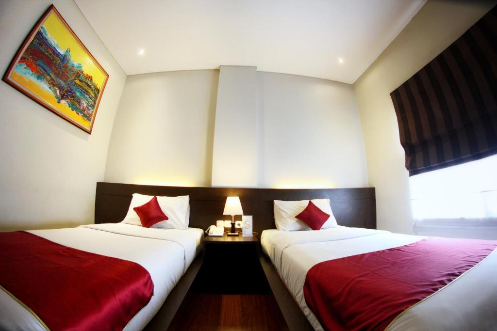 Cama o camas de una habitación en Sutan Raja Guest House