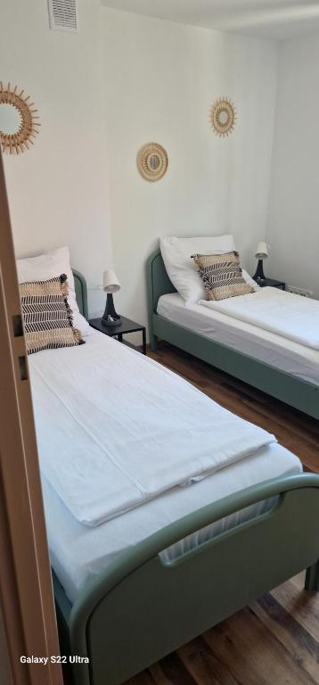 Posteľ alebo postele v izbe v ubytovaní Apartamenty Mikołajki na Kajki