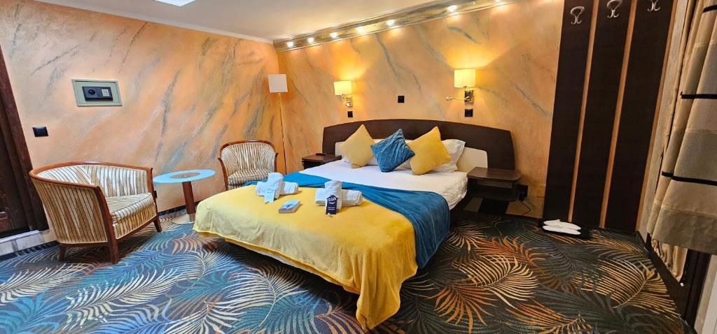 a bedroom with a bed in a room at La Dolce Vita in Braşov