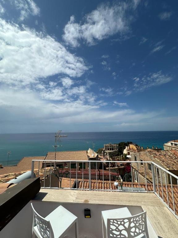 a view of the ocean from the balcony of a house at Affaccio sul Mare Attico in Tropea