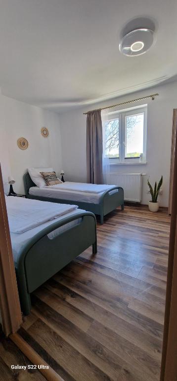 Posteľ alebo postele v izbe v ubytovaní Apartamenty Mikołajki na Kajki