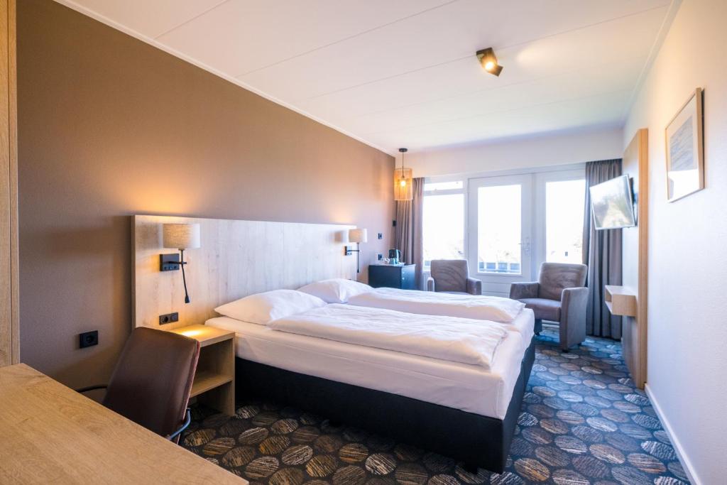 Postel nebo postele na pokoji v ubytování Hotel Hofker