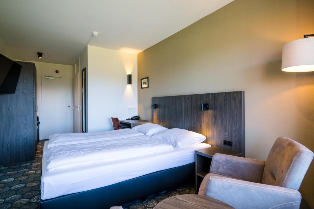 Postel nebo postele na pokoji v ubytování Hotel Hofker