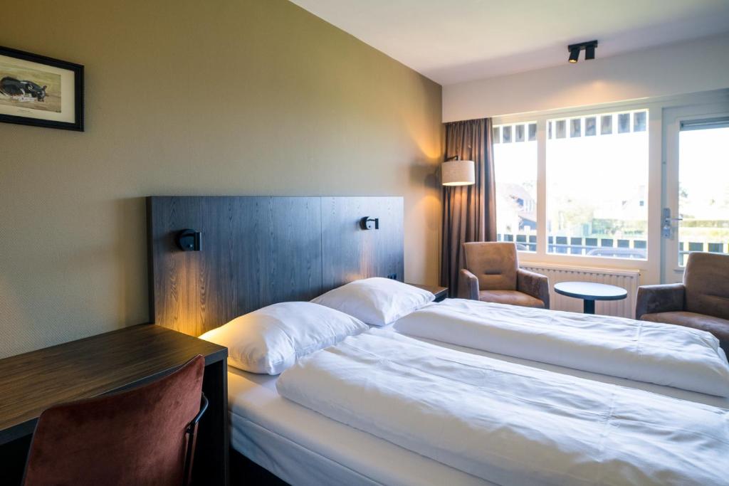 Postel nebo postele na pokoji v ubytování Hotel Hofker