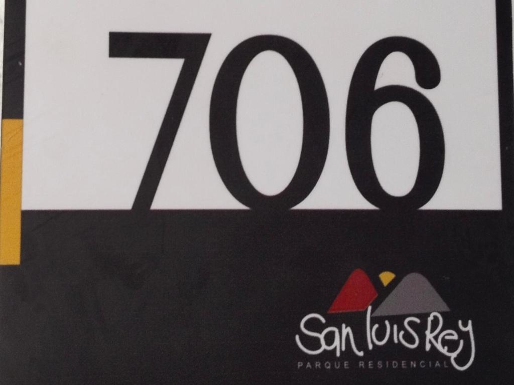 a sign for a restaurant with the number at Apartamento Norte de Armenia Salida para Salento y Filandia in Armenia