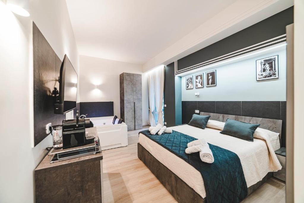 a bedroom with a large bed and a bathroom at Monteverde Vatican in Rome
