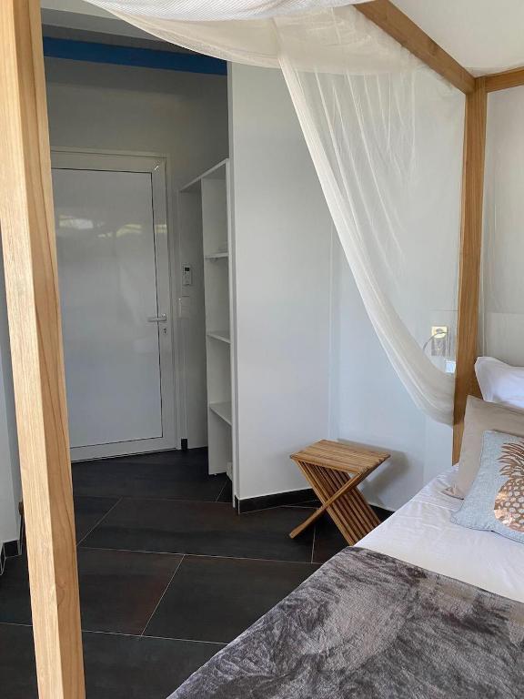 Postel nebo postele na pokoji v ubytování Le Jardin des Ilets