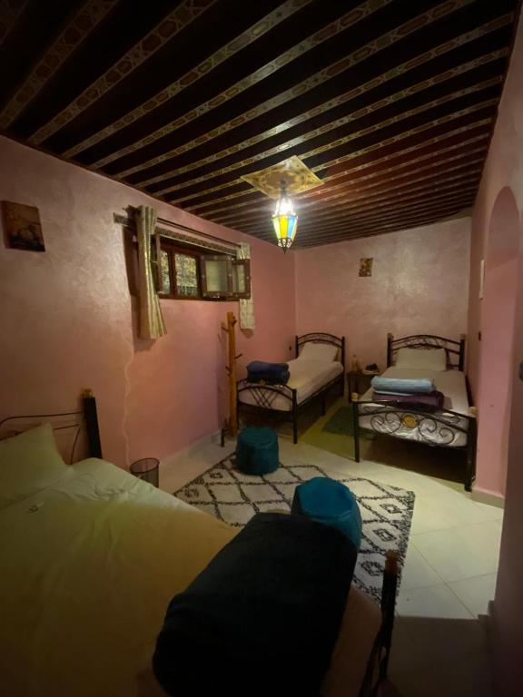 Postel nebo postele na pokoji v ubytování la Kasbah salam