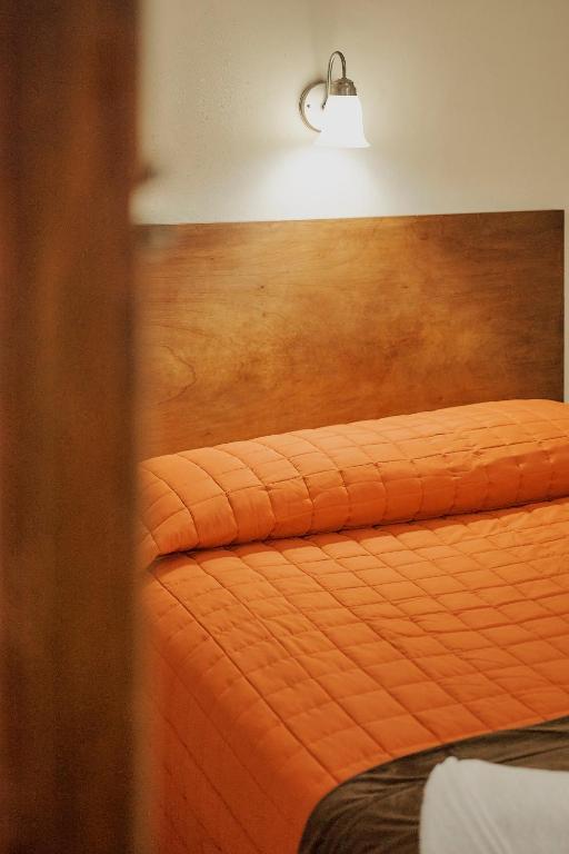 Postel nebo postele na pokoji v ubytování Hotel Cervantino