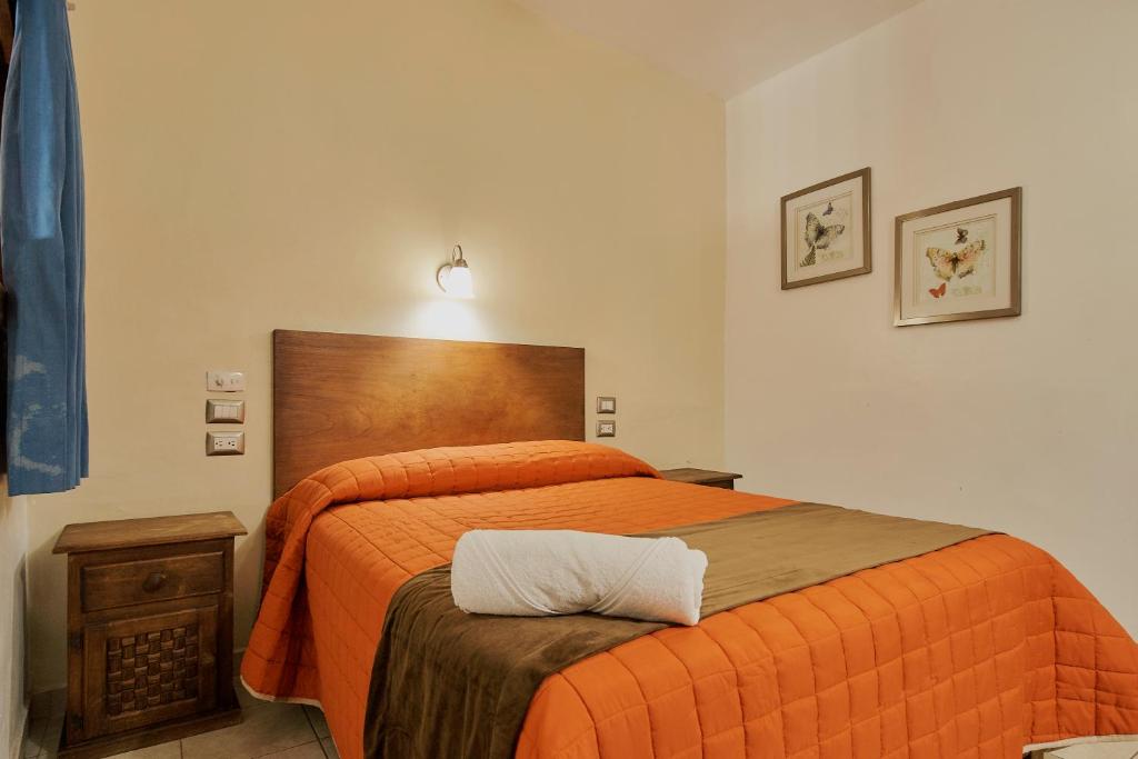 Postel nebo postele na pokoji v ubytování Hotel Cervantino
