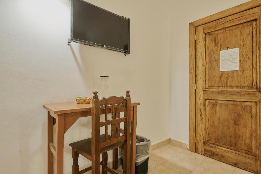 TV a/nebo společenská místnost v ubytování Hotel Cervantino