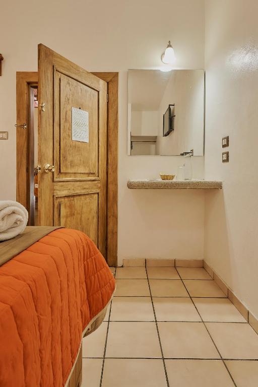 Kuchyň nebo kuchyňský kout v ubytování Hotel Cervantino