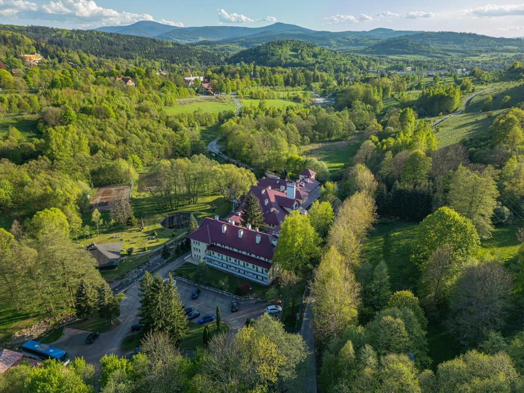 an aerial view of a building in a forest at Geovita Lądek Zdrój in Lądek-Zdrój