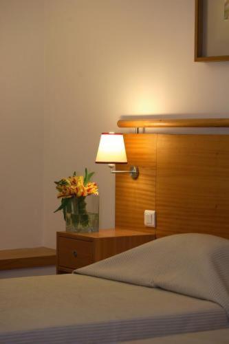Postel nebo postele na pokoji v ubytování Hotel do Lago