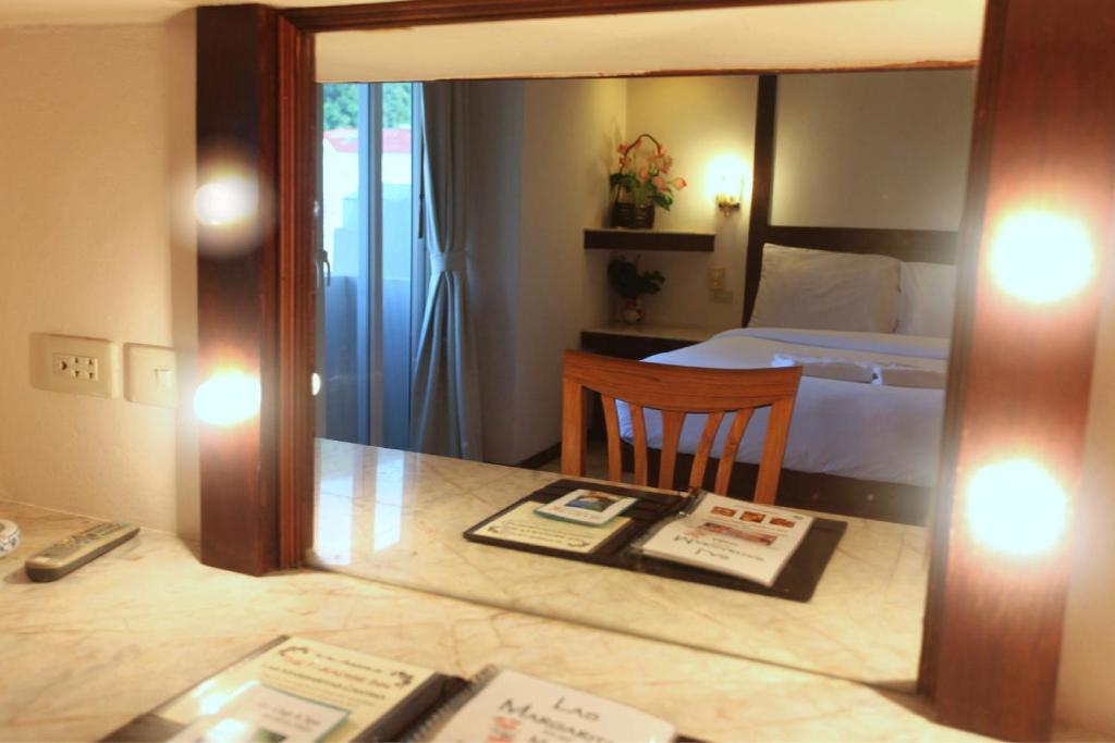 Postel nebo postele na pokoji v ubytování Paradise Inn
