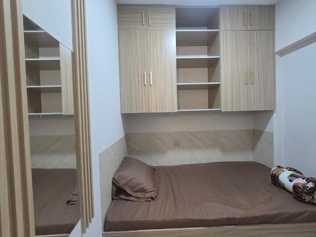 Ein Bett oder Betten in einem Zimmer der Unterkunft Garden Residence