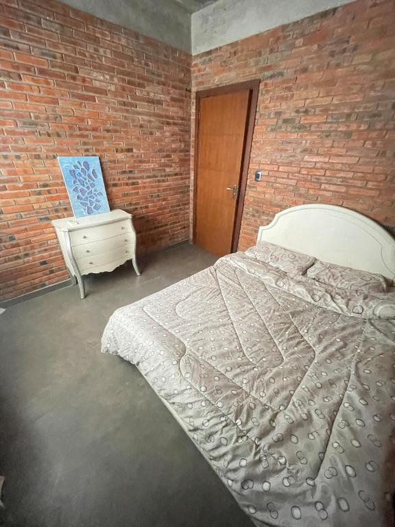 Postel nebo postele na pokoji v ubytování Amplia, moderna y tranquila casa