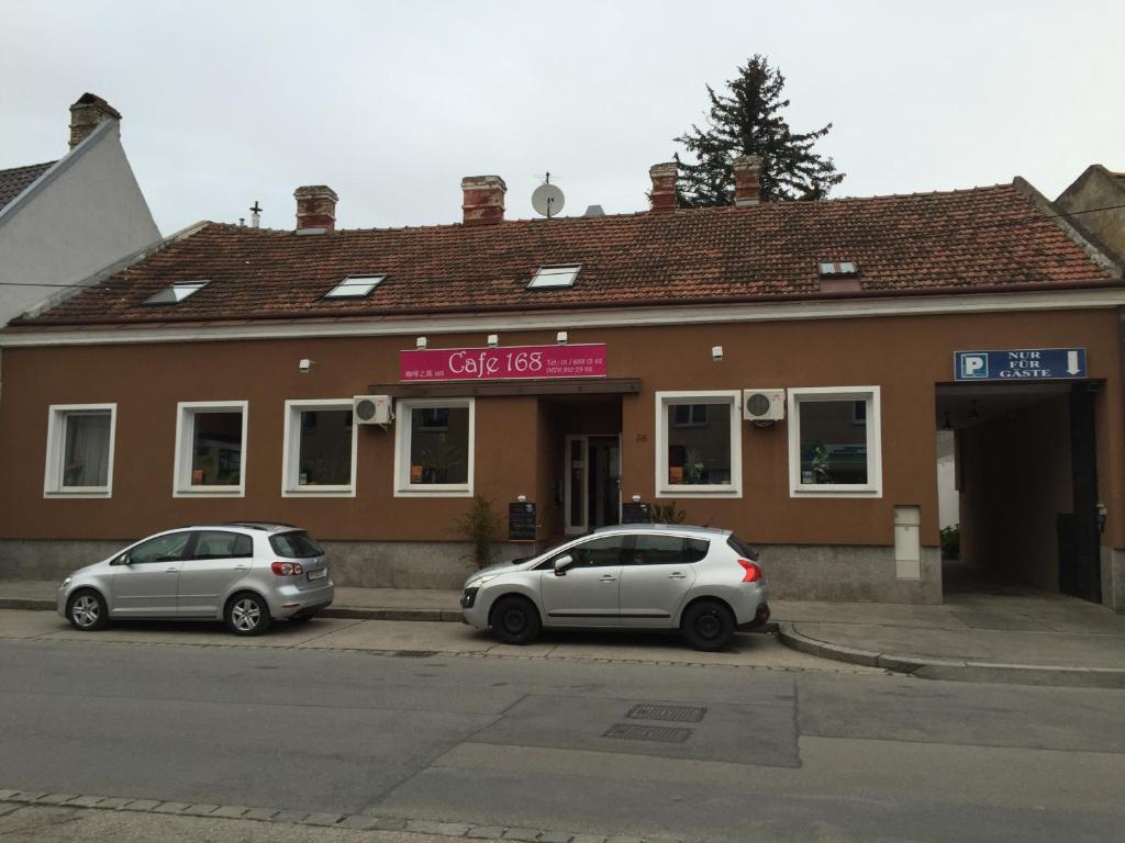 two cars parked in front of a building at Cáfe 168 in Vienna