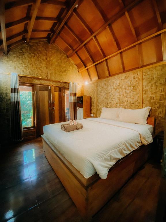 Postel nebo postele na pokoji v ubytování Coffee Homestay Tetebatu