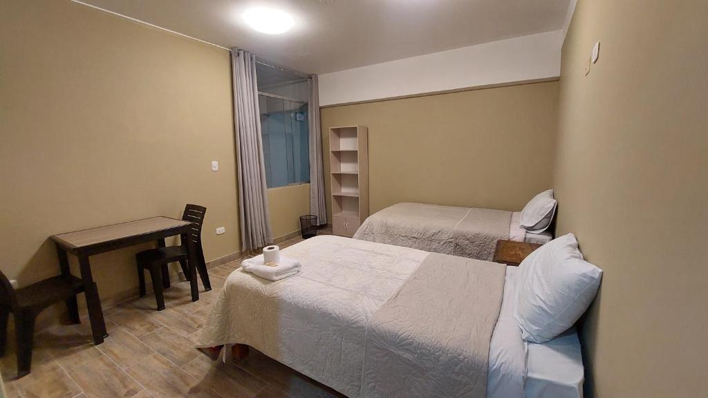 Postel nebo postele na pokoji v ubytování Lonko Central