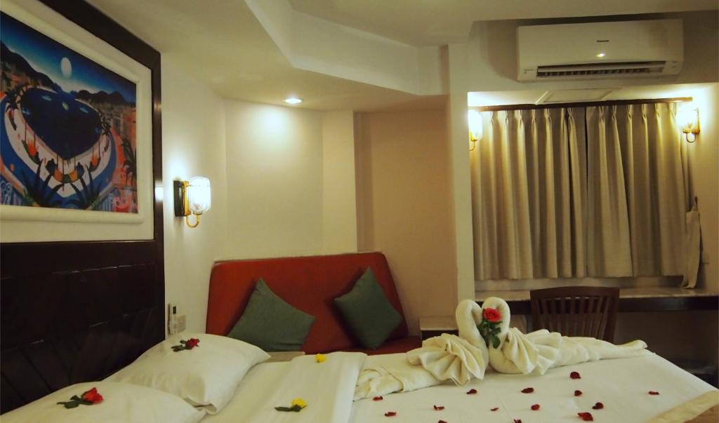 Postel nebo postele na pokoji v ubytování Paradise Inn