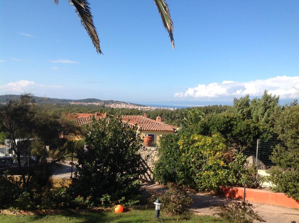 a view from the garden of a house with trees at Villa Kuky in Santa Teresa Gallura