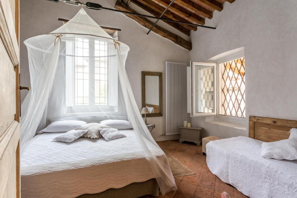 Postel nebo postele na pokoji v ubytování Casa Di Laura