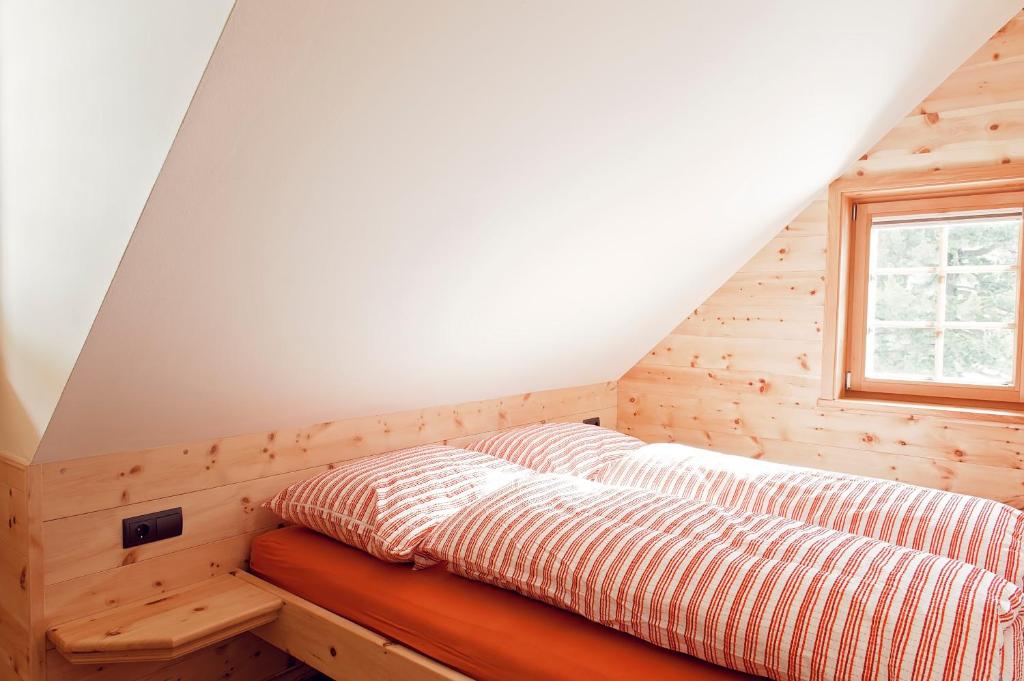 Posteľ alebo postele v izbe v ubytovaní Sandrisser-Hütte