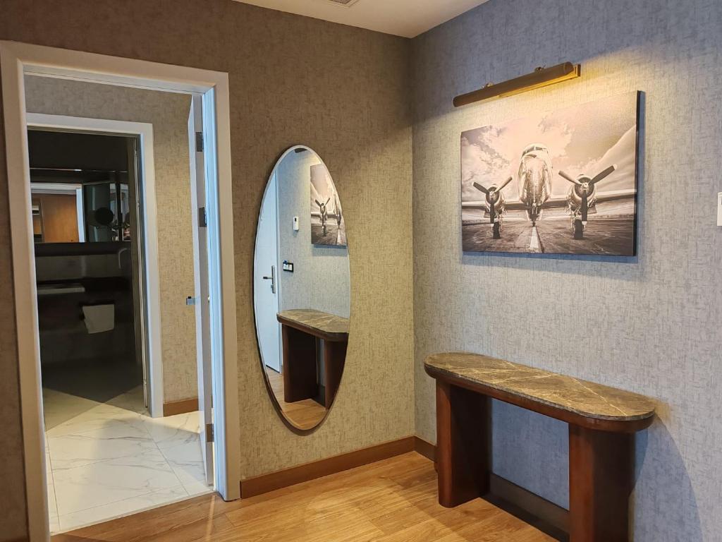 a dressing room with a mirror and a sink at ISG Sabiha Gökçen Airport Hotel in Istanbul