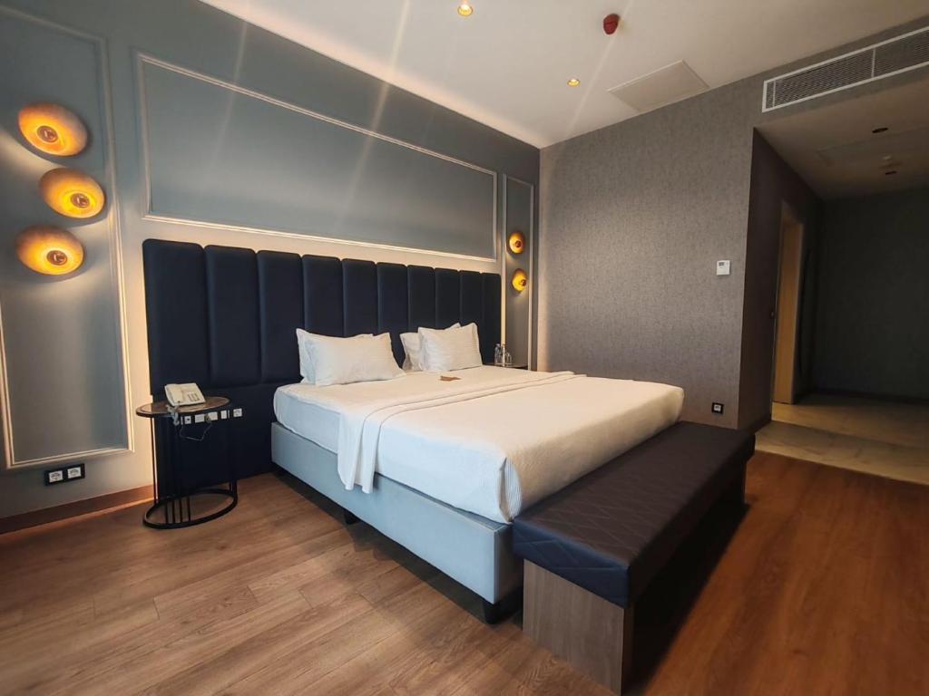 a bedroom with a large bed and a telephone at ISG Sabiha Gökçen Airport Hotel in Istanbul