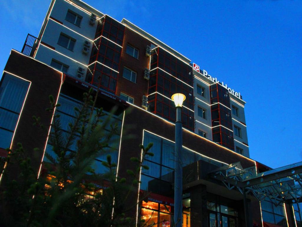 a tall building with a street light in front of it at Park Hotel in Ulaanbaatar