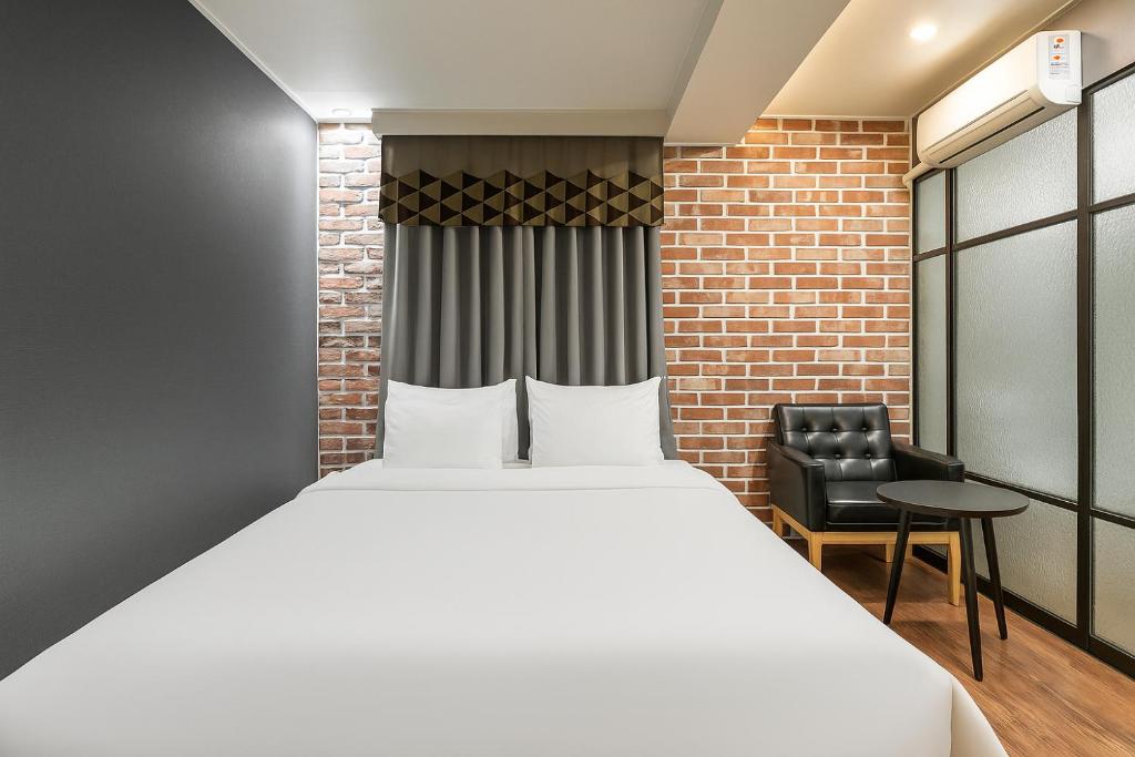 Postel nebo postele na pokoji v ubytování Hotel Lin