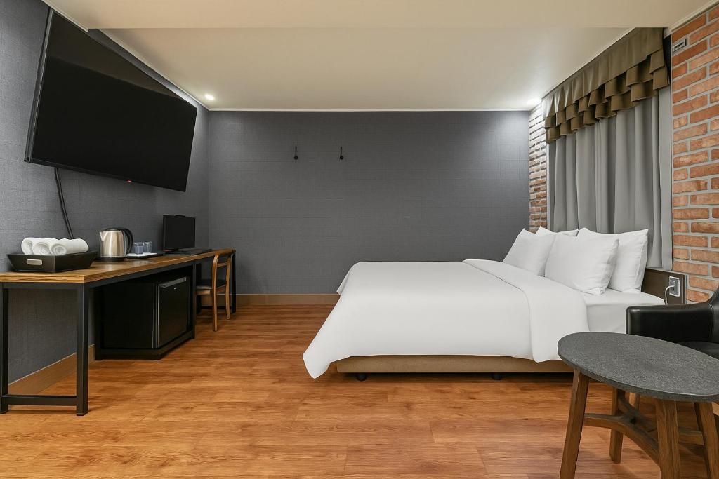 Postel nebo postele na pokoji v ubytování Hotel Lin