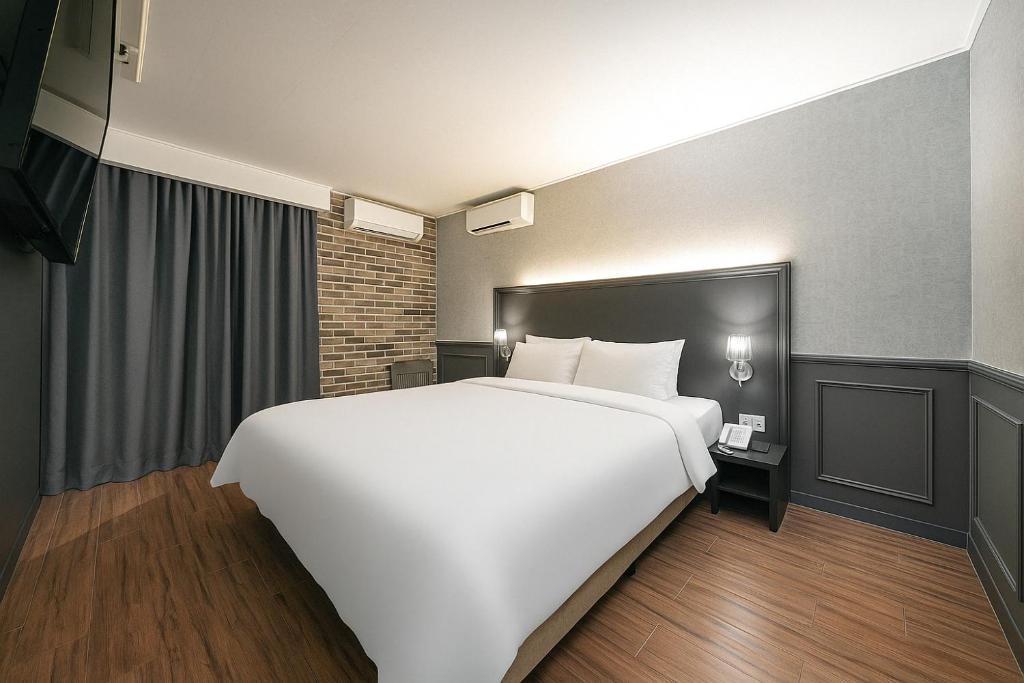 Postel nebo postele na pokoji v ubytování Hotel Lin