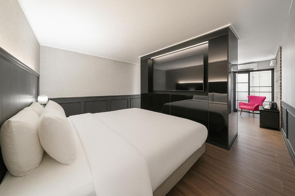 Postel nebo postele na pokoji v ubytování Hotel Lin