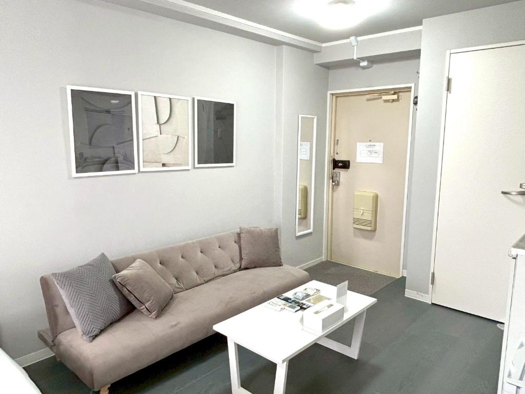 Posezení v ubytování Neighbor's Hotel 西十日市