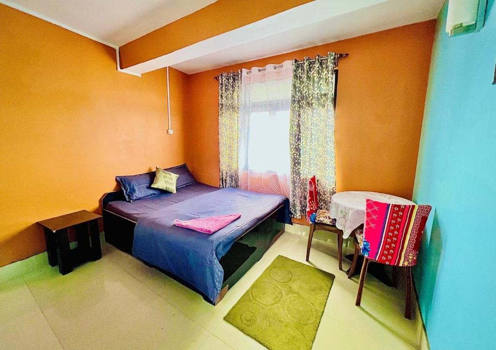 Ένα ή περισσότερα κρεβάτια σε δωμάτιο στο Darjeeling Homes The Glory
