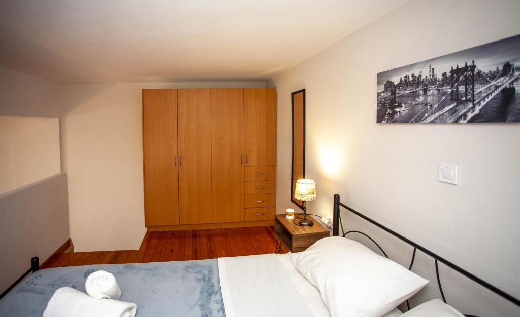 Postel nebo postele na pokoji v ubytování Unique Apartment