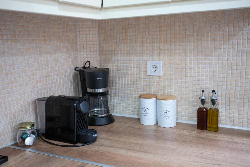 Kuchyň nebo kuchyňský kout v ubytování Unique Apartment