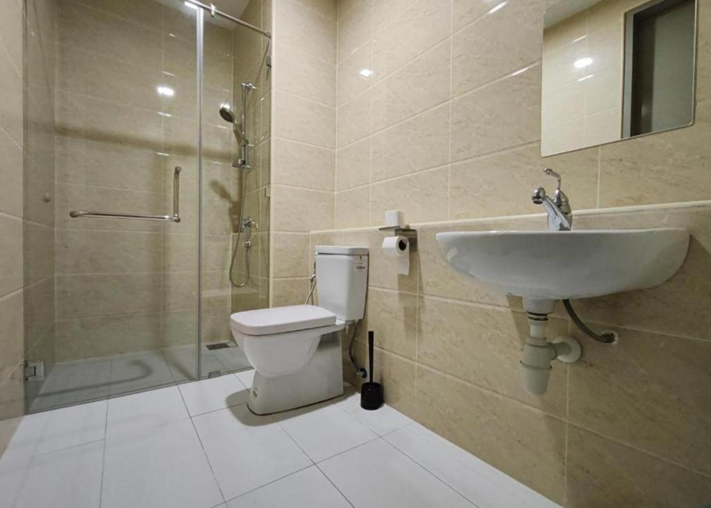a bathroom with a toilet and a sink and a shower at KL Sky Condo - Top Floor in Kuala Lumpur