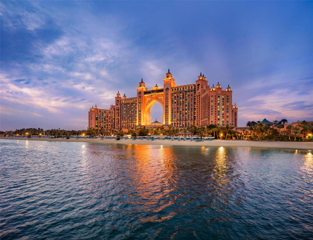 a view of the bellagio hotel from the water at night at Atlantis, The Palm in Dubai