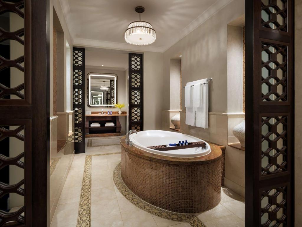 a bathroom with a large tub in the middle at Atlantis, The Palm in Dubai