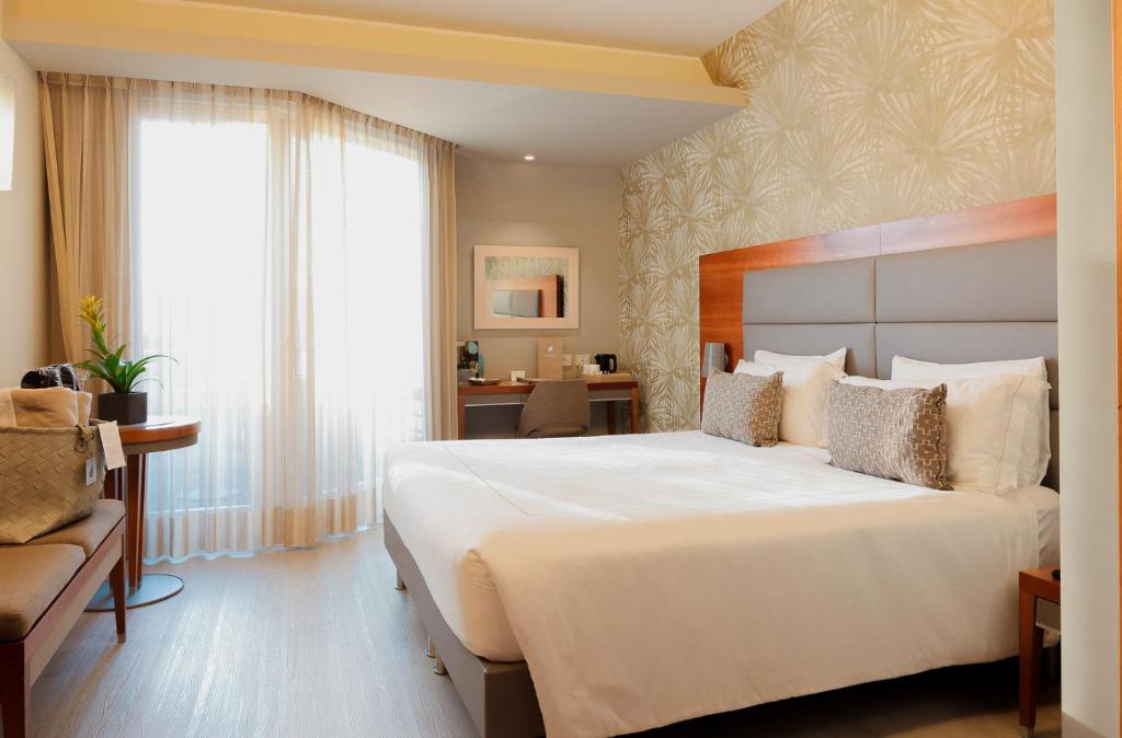 Postel nebo postele na pokoji v ubytování Hotel Corte Valier