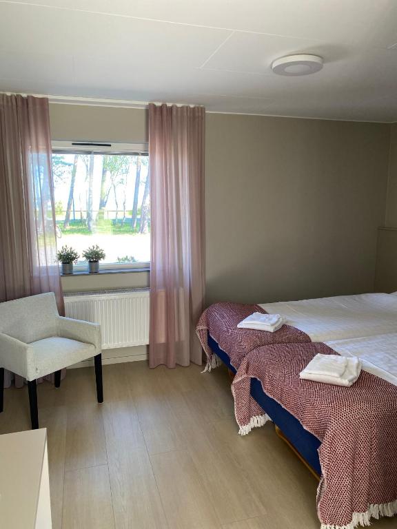 Postel nebo postele na pokoji v ubytování Höllviksnäs möten mat logi