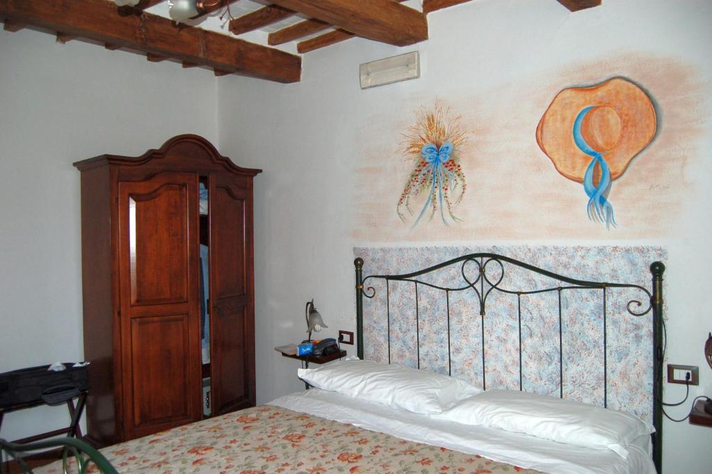 Postel nebo postele na pokoji v ubytování Hotel Leonardo