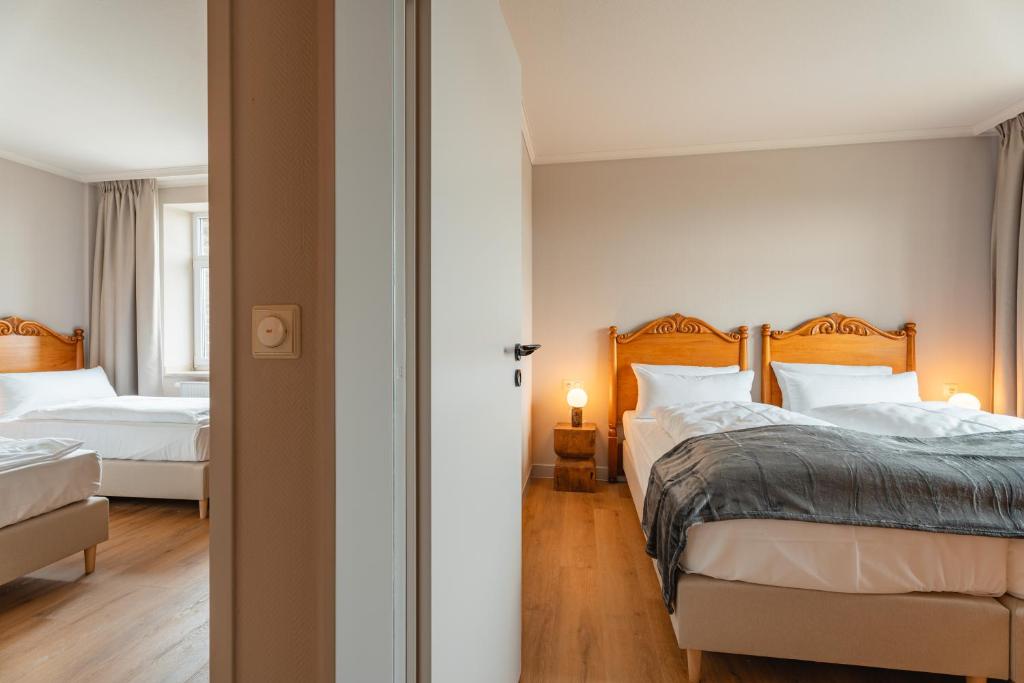 Postel nebo postele na pokoji v ubytování Naturhotel Sachsenbaude Oberwiesenthal